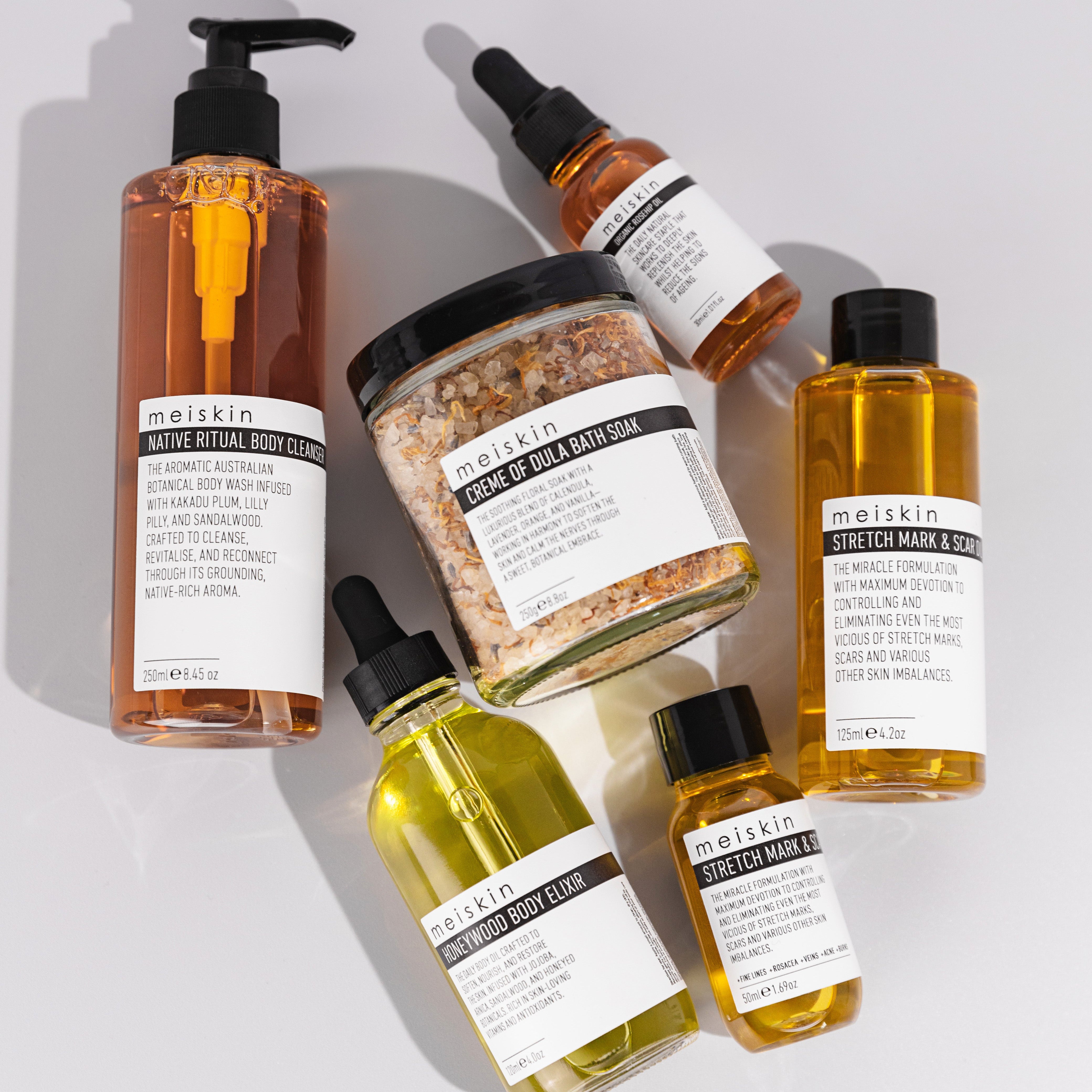 Collection of Meiskin skincare products from the brand 'meiskin' on a light gray background