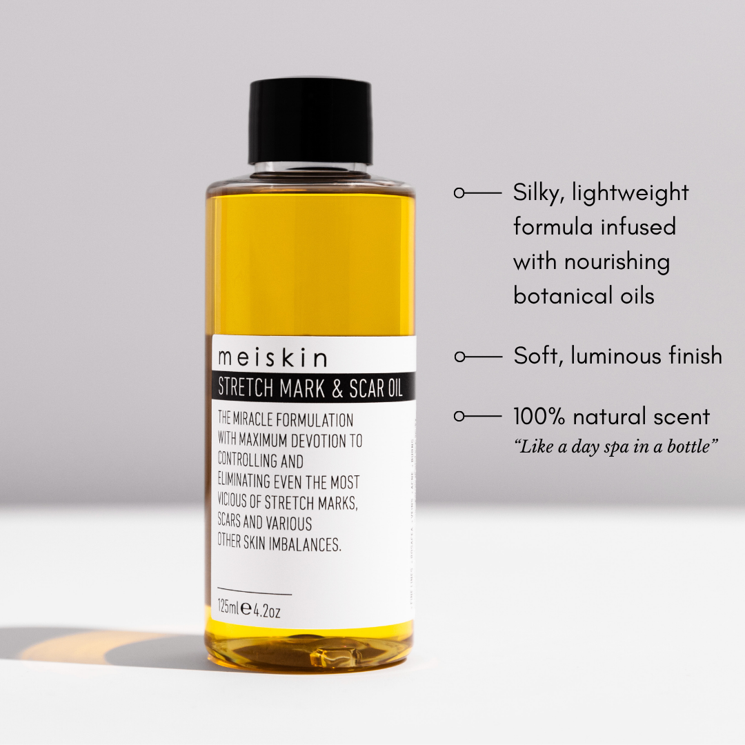 Meiskin stretch mark and scar oil bottle with features listed on a gray background