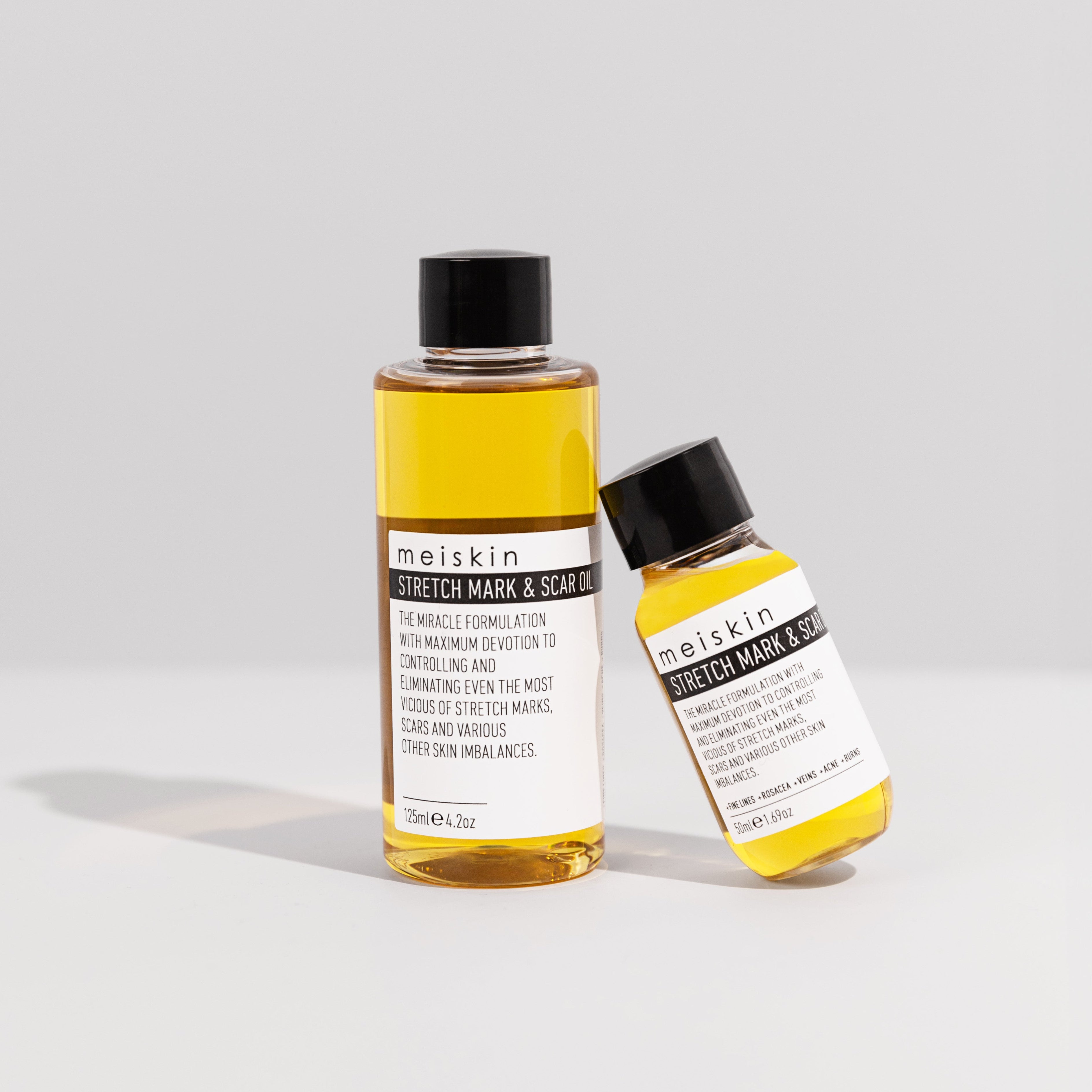 Two Meikin skincare bottles on a light gray background